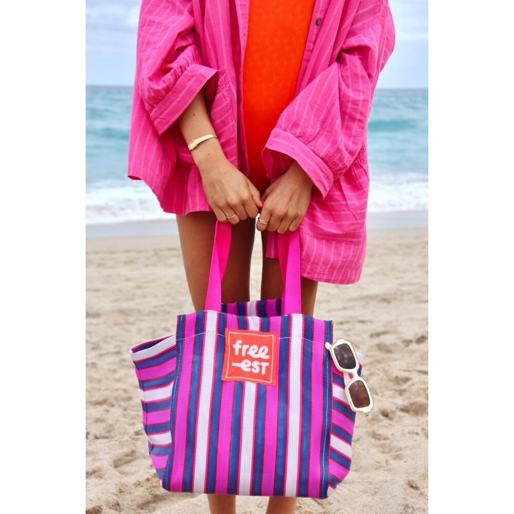 Free People Free-Est striped tote bag featuring bright pink handles & logo patch